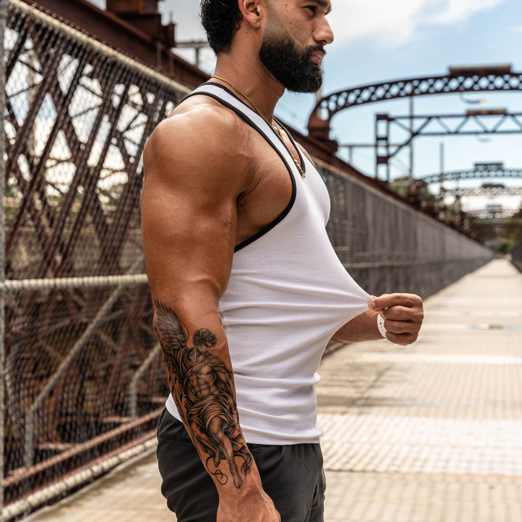 stretching LionBuilt tank top to show premium cotton blend